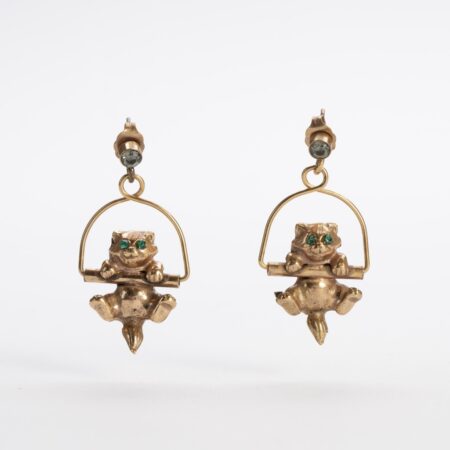 Pendant earrings in the shape of a cat on a swing