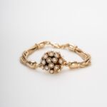 Bracciale con sfera di perle d'imitazione