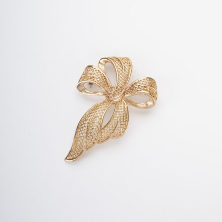 Elegante spilla fiocco, in lega francese demirouge, dorata oro 14 KT.