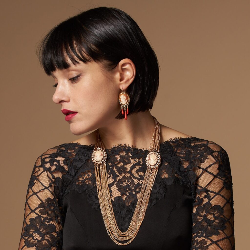 Dangling cameo earrings with red coral drops