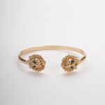 Bracciale rigido con teste di leone