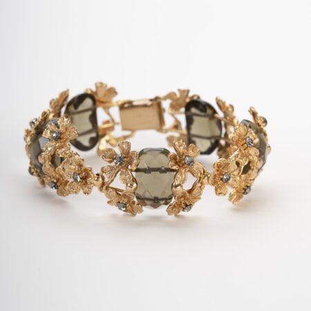Bracciale artigianale Non ti scordar di me in lega demirouge dorata oro 14 KT con fiori scolpiti e cristalli grigio fumo